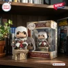 Front view of Altair Ibn-Laahad Assassins Creed 20th Anniversary Figure standing on a stone base next to its display box.