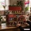 Arsenal FC Christmas Football Advent Calendar featuring miniature player figurines and ornaments on a wooden tiered stand.