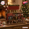 Arsenal FC Christmas Football Advent Calendar featuring miniature player figurines and stadium ornaments on wood shelving.