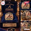 Closeups of an Atlanta Braves 2026 NL East Champions ring inside a dark blue display box.