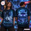 Front and back view of a black t-shirt featuring glowing blue forest spirit graphics from an Avatar Pandora forest scene.