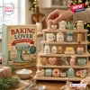 Baking Lover Advent Calendar 2026 box with 24 cute acrylic ornaments arranged on a tiered wooden display stand.