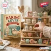 Baking Lover Advent Calendar 2026 with 24 miniature acrylic ornaments featuring kitchen themed charms on wooden shelves.