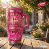 Front view of a pink Stanley tumbler with 67th anniversary graphic and handle.