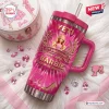 Front view of a pink Yeti tumbler featuring 67th anniversary graphics and gemstones on fur.