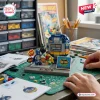 Close-up of a person building a Batman 1966 Classic TV Series Brick Set with minifigures and a round bomb prop on a desk.