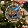Close-up of a Batman 1966 Gotham City Christmas ornament hanging on a pine tree branch.