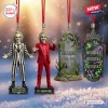 Four hanging ornaments including two character figures, a tombstone, and a tombstone-shaped graphic plaque.