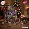 Front view of Beetlejuice It's Showtime 2026 Advent Calendar box with holiday figurines on a wooden table.