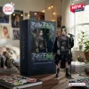 Front view of a Billie Eilish collectible figure standing beside its branded presentation box on a wooden desk.