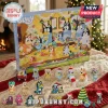 Bluey Family Christmas 24-Piece Advent Calendar features numbered doors and miniature character figurines on a soft blanket.