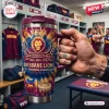 Hand holding a Brisbane Lions YETI Stanley Tumbler inside a locker room setting.