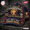 Front view of the Brisbane Lions 2026 Three-Peat Championship Cap with embroidered lion logo and text.
