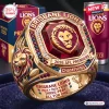 Closeup of Brisbane Lions 2026 Three-Peat Gold Ring featuring a large red gemstone and lion motif.