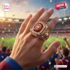 Closeup of Brisbane Lions 2026 Three-Peat Gold Ring worn on a hand at a stadium.