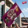 Angled view of the Brisbane Lions AFL 2026 Premiers Maroon House Flag held outdoors.