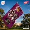 Outdoor view of a Brisbane Lions AFL 2026 Premiers maroon house flag flying on a pole outdoors.