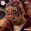 Closeup of a person wearing the Brisbane Lions AFL Premiers Distressed Cap with embroidered team graphics.