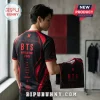 BTS World Tour 2026 Black Red Football Jersey worn by a model, featuring band member names and geometric graphic designs.