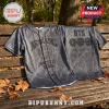BTS World Tour Arirang 2026 Limited Edition Baseball Jersey featuring black fabric, grey patterns, and front text display.