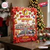 Front view of a rectangular red Buc-ee's 45th Anniversary Advent Calendar 2026 box decorated with red bows on a wooden table.