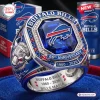 Close-up of a Buffalo Bills 66th Anniversary championship ring with a large blue center stone and red and blue accents.