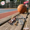 Close-up of a Caitlin Clark USA Basketball 2026 World Cup keychain resting on a wooden bench with a basketball background.