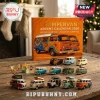 Campervan Christmas Advent Calendar 2026 box with a colorful retro van illustration and small diecast van models on a table.