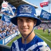 Front view of a person wearing a blue Canterbury-Bankstown Bulldogs 91st Anniversary bucket hat at a sports stadium.