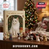 Cat Christmas Advent Calendar 2026 featuring white cat art and 24 numbered perforations on a wooden tabletop with figurines.