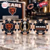 Front view of three poker chips with team branding, including a bear logo and trophy icon, placed on a marble surface.