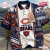 Front view of a Chicago Bears NFL polo shirt featuring a roaring bear graphic, helmet, and stadium print.