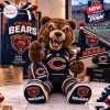 Front view of Chicago Bears plush mascot pillow holding a team flag and football in a stadium setting.