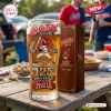 Front view of a Cleveland Indians Chief Wahoo 125th anniversary beer glass on a wooden table with a wooden box.