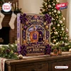 Front view of a purple 87th Anniversary Crown Royal advent calendar standing on a wooden table with festive decor.