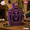Crown Royal 88th Anniversary Advent Calendar in a bottle-shaped purple box with gold decorative accents and holiday lights.