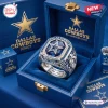 Close-up view of a silver Dallas Cowboys 66th Anniversary commemorative ring inside a blue presentation box.