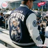Back view of a person wearing a Dallas Cowboys football mascot baseball jacket with large mascot patch.