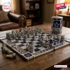 Dallas Cowboys NFL Chess Set with blue and silver pieces and a matching AT&T Stadium storage tin on a wooden table.
