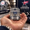 Dallas Cowboys NFL Chess Set rook piece shaped like AT&T Stadium held in a hand with blue and silver metallic finishes.