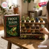Day Frogs and Toads Advent Calendar 2026 featuring 24 detailed acrylic amphibian figurines on a tiered wooden display stand.