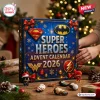 Front view of a blue DC Super Heroes Advent Calendar 2026 box decorated with festive ribbons and hero logos.