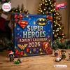 Front view of a DC Super Heroes Advent Calendar 2026 box with festive red ribbons and small character figurines.