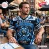 Front view of a man wearing a blue and black Detroit Lions football graphic T-shirt with a roaring lion design.