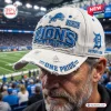 Close up view of a distressed white baseball cap featuring Lions text and a city skyline graphic.