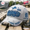 Side view of a white distressed Detroit Lions One Pride baseball cap with blue embroidery and city skyline graphic.