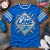 Front view of a blue t-shirt featuring Stay In Your Lane text and a lion icon inside a diamond graphic frame.