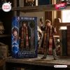 Figure of The Fourth Doctor with long multi-colored scarf and hat next to its Doctor Who Heritage Collection packaging.