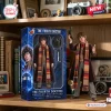 Front view of Doctor Who Heritage Collection Hot Toys figure posed with a long scarf and hat on a wooden shelf.