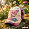 Front view of Dolly Butterfly Patchwork Baseball Cap with embroidered pink butterfly and floral motifs resting on stone.